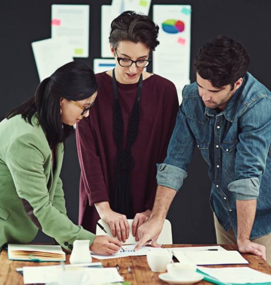 cropped shot of a group of young creatives having a meeting