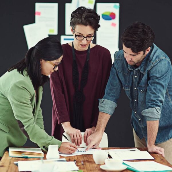 cropped shot of a group of young creatives having a meeting